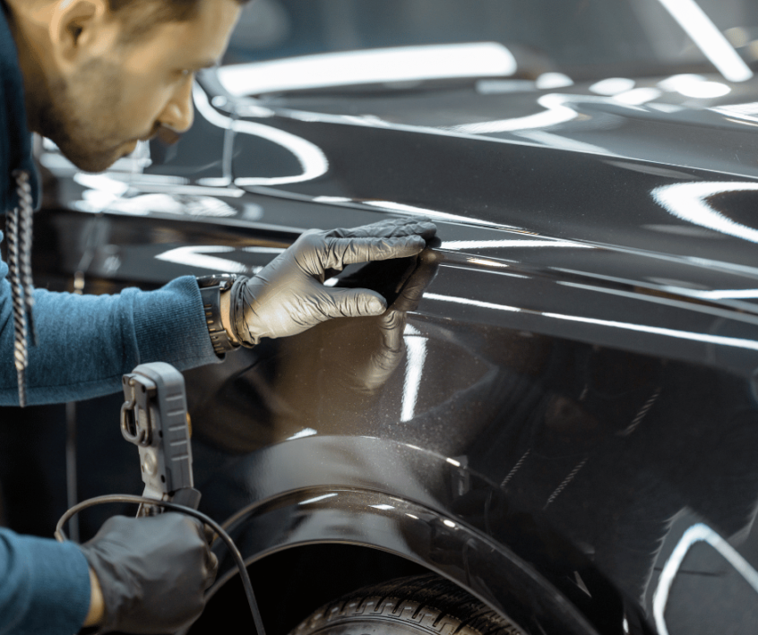 Image of dent repair in auto body shop