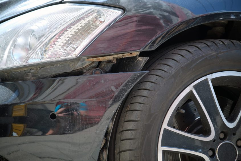 Loose bumper before professional auto body repair
